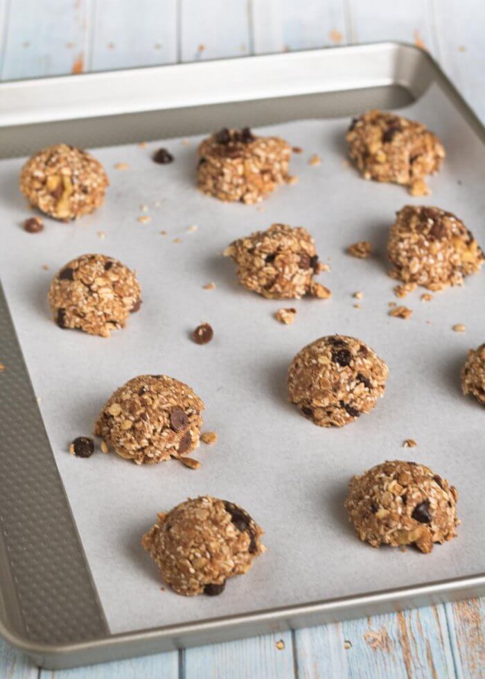 vegan oatmeal cookies on a baking sheet ready for baking
