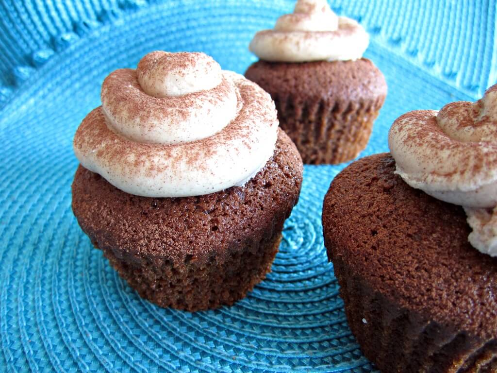 chocolate gingerbread cupcakes with buttercream and cinnamon sprinkles