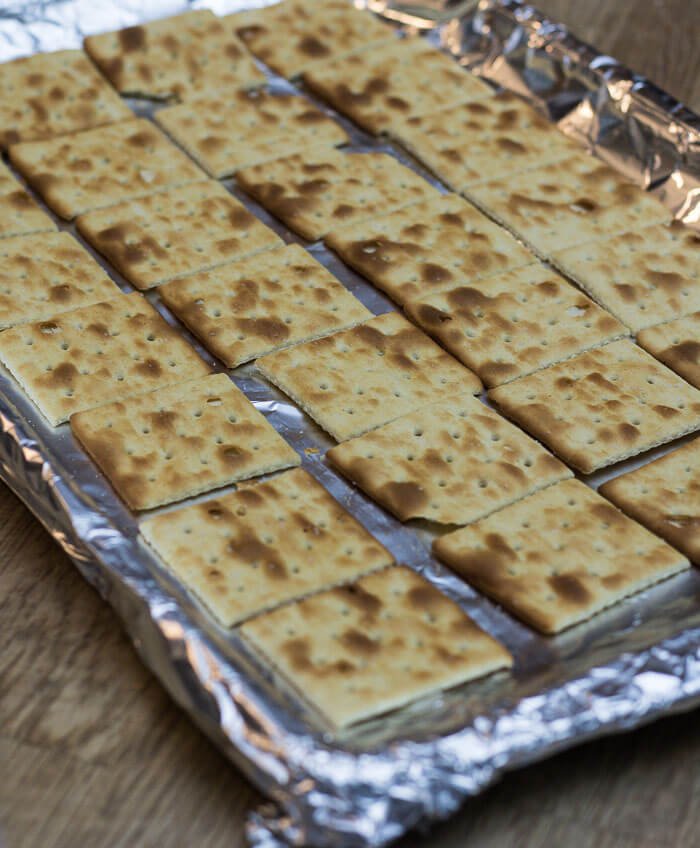tin foil lined baking tray with saltines for making candy