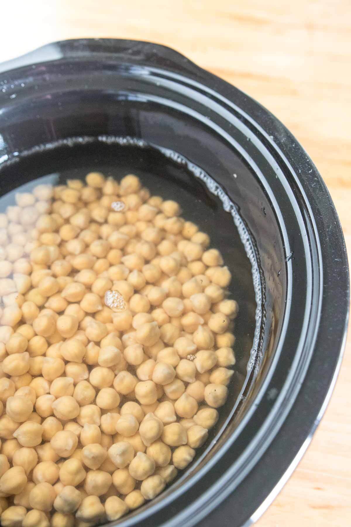 garbanzo beans ready to cook in a slow cooker