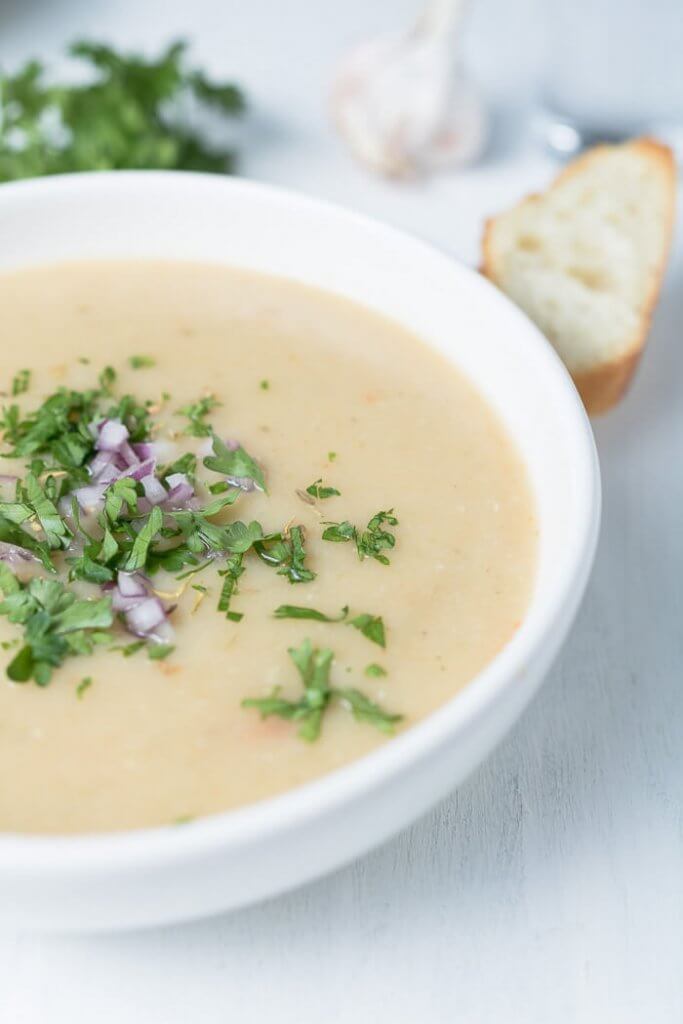 cream of garlic soup in a white bowl