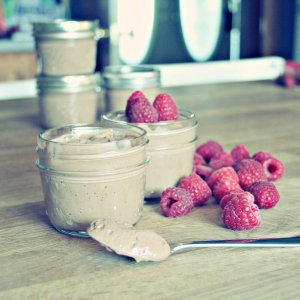 vegan chocolate mousse in single serve cups with fresh raspberries