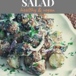 bbq'd red potato salad with onions and parsley on a oval platter