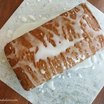 lemon flaxseed bread, top view of bread, drizzled with lemon glaze