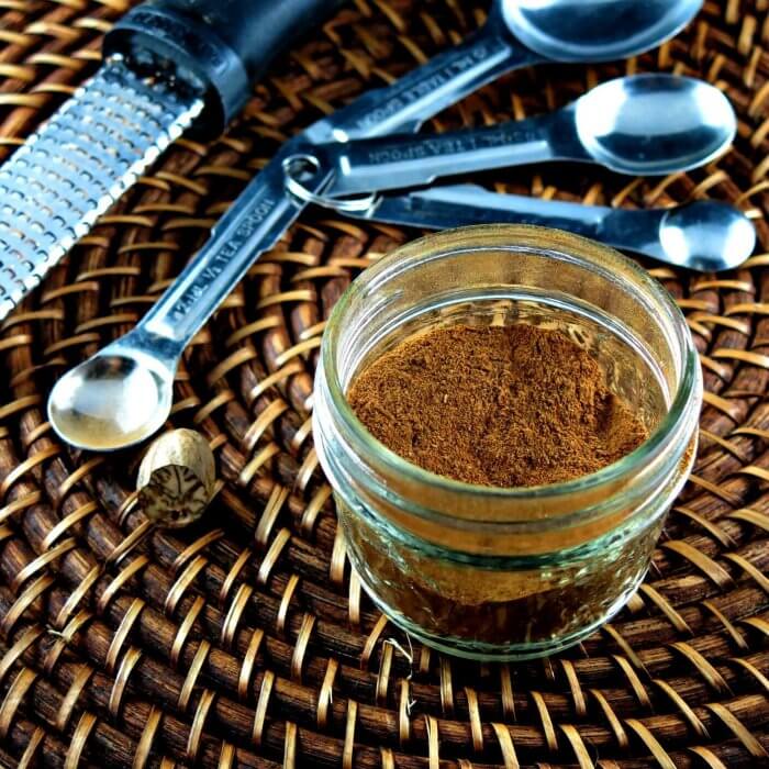 pumpkin pie spice mix with measuring spoons