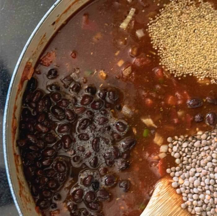 adding beans, quino and lentils to chili
