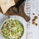 raw Brussels Sprout salad with Parmesan and toasted walnuts ready to serve