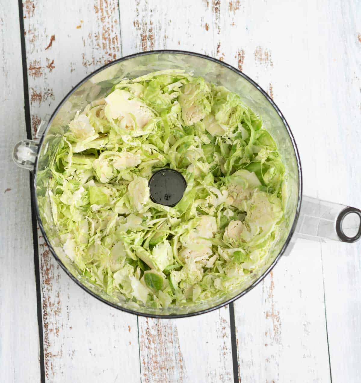 use a food processor with a slicing blade to prep Brussels sprouts for this raw sprout salad
