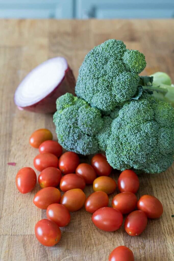 broccoli, red cherry tomatoes and red onion