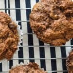 double chocolate banana muffins on a blue and white background