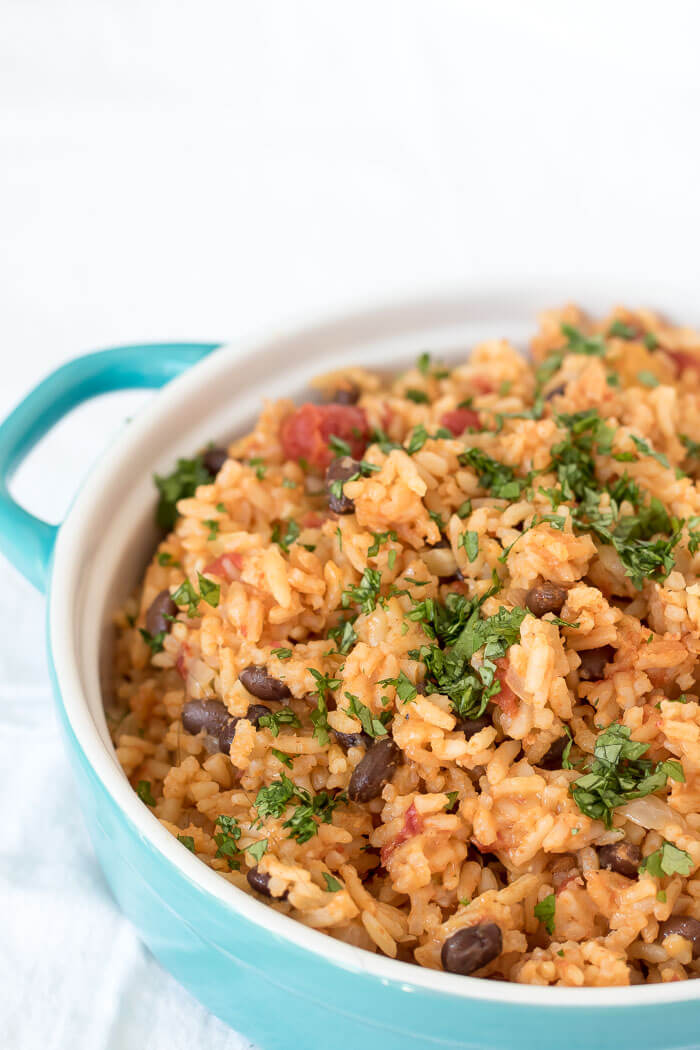 chipotle rice casserole with black beans and cilantro on top