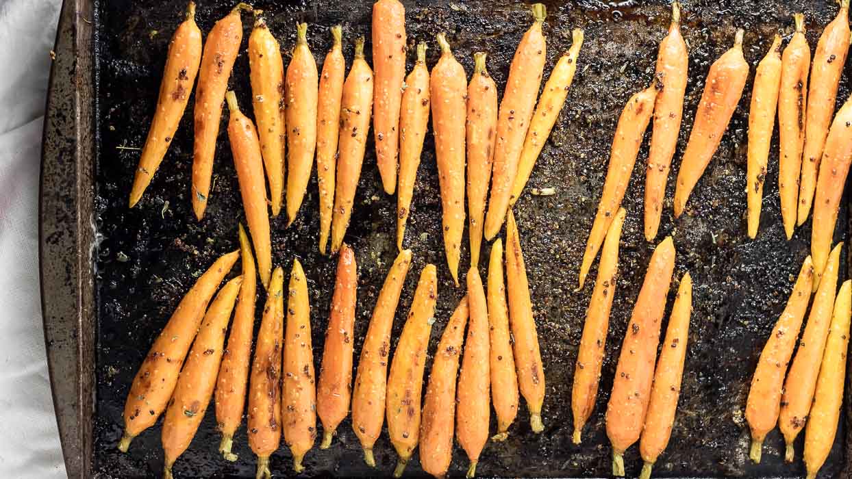 roasted carrots fresh out of the oven with maple glaze ready for serving