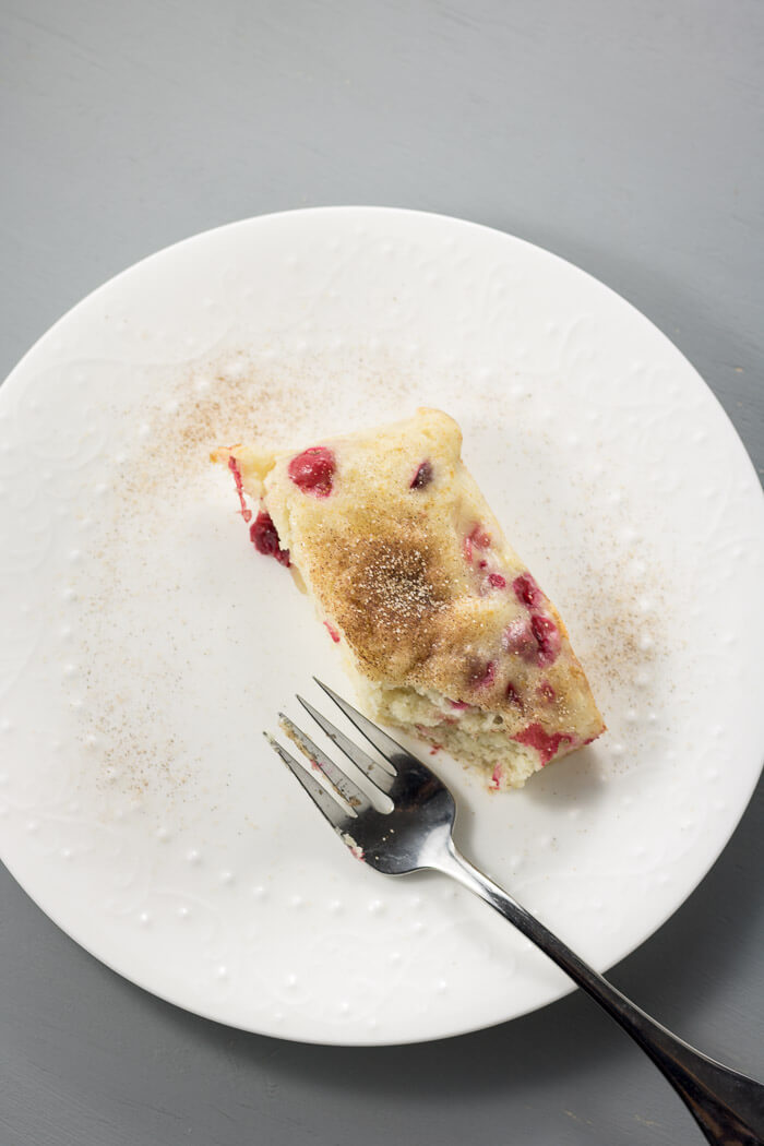 slice of cranberry cake on white plate