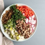 wheat berry lunch bowl with pears, almonds, and greens