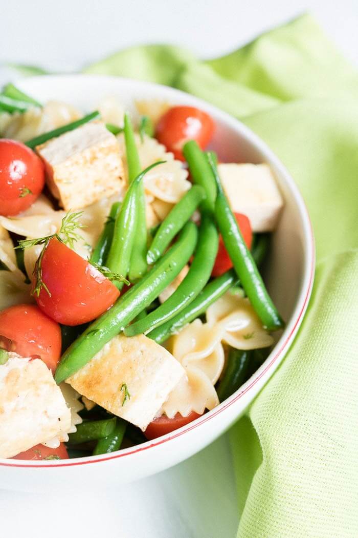 Close up of Summer Pasta Salad with Tofu, Cherry Tomatoes and Green Beans