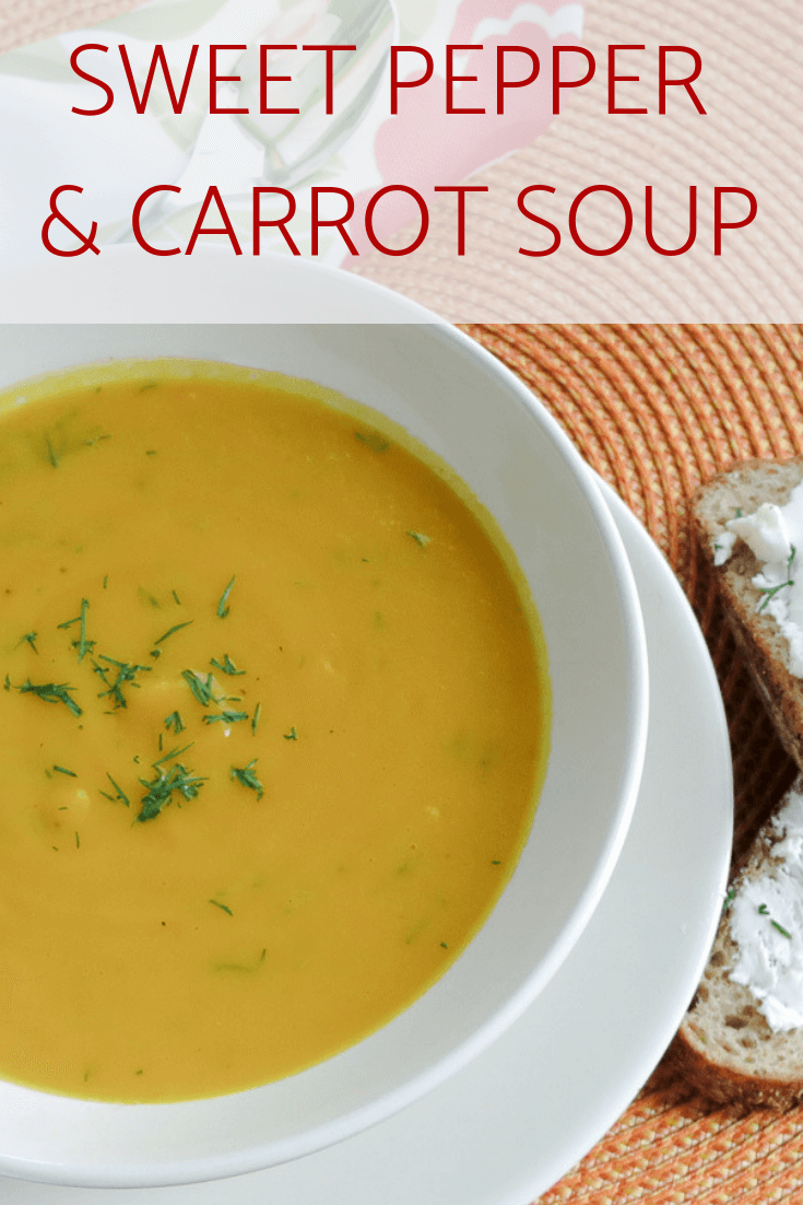 Sweet pepper and Carrot Soup in a bowl with dill. 