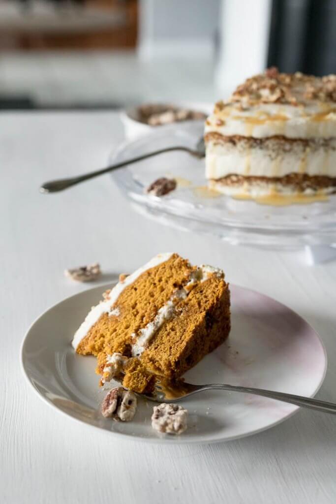 praline and pumpkin cake sliced with cake in the background