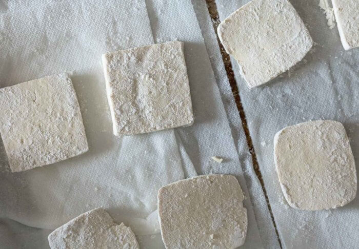 tofu dusted with flour for frying