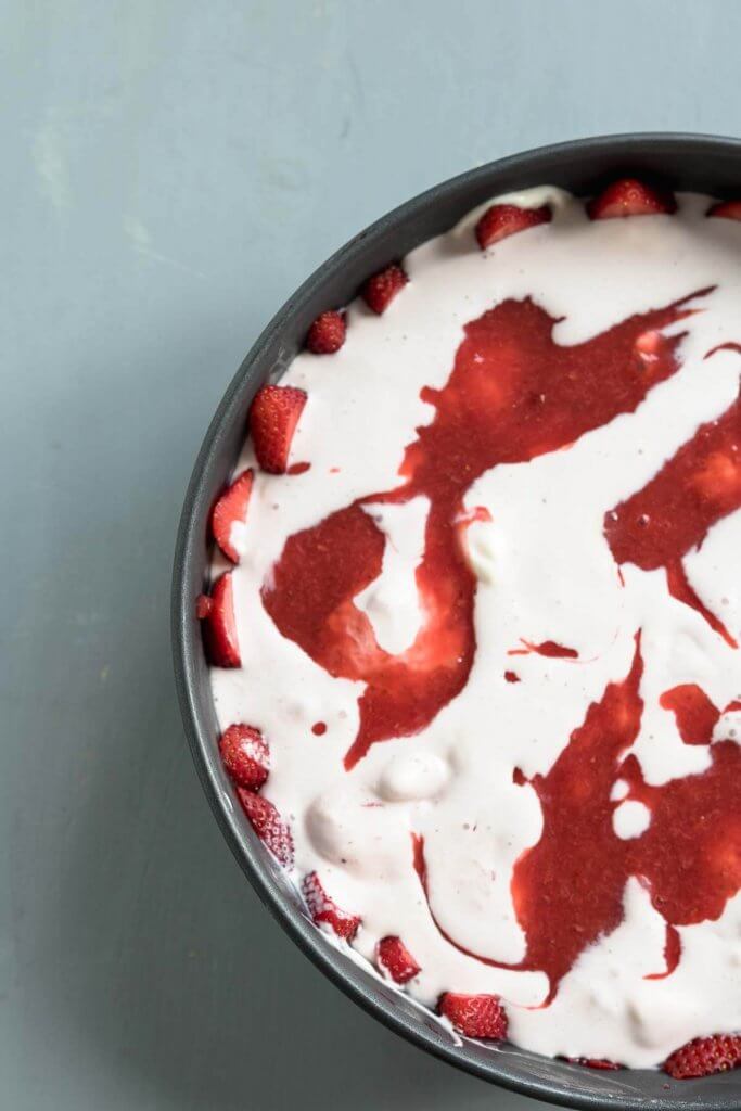 another layer of fresh strawberry sauce in ice cream cake