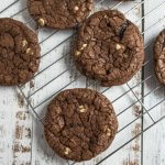 dark chocolate crinkle cookies on a cooling rack