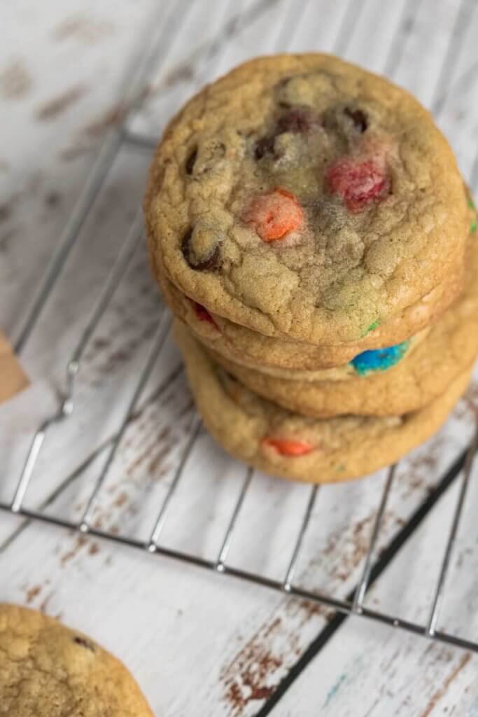 a stack of soft chocolate chip cookies made with chocolate M&M candies