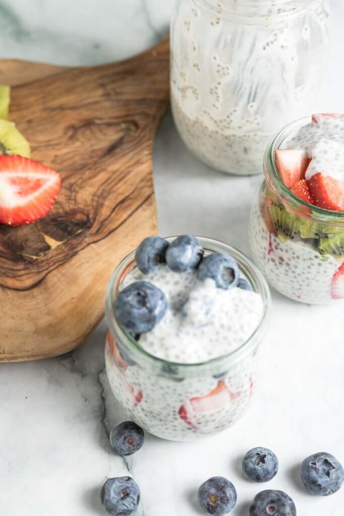 vanilla chia seed pudding with berries in a mason jar 