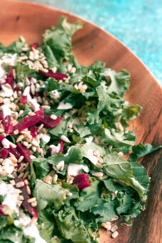 kale salad with beets, brown rice, sunflower seeds and tahini dressing
